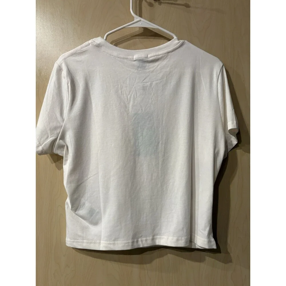 True Religion t-shirt features a pink bandana-printed horseshoe logo